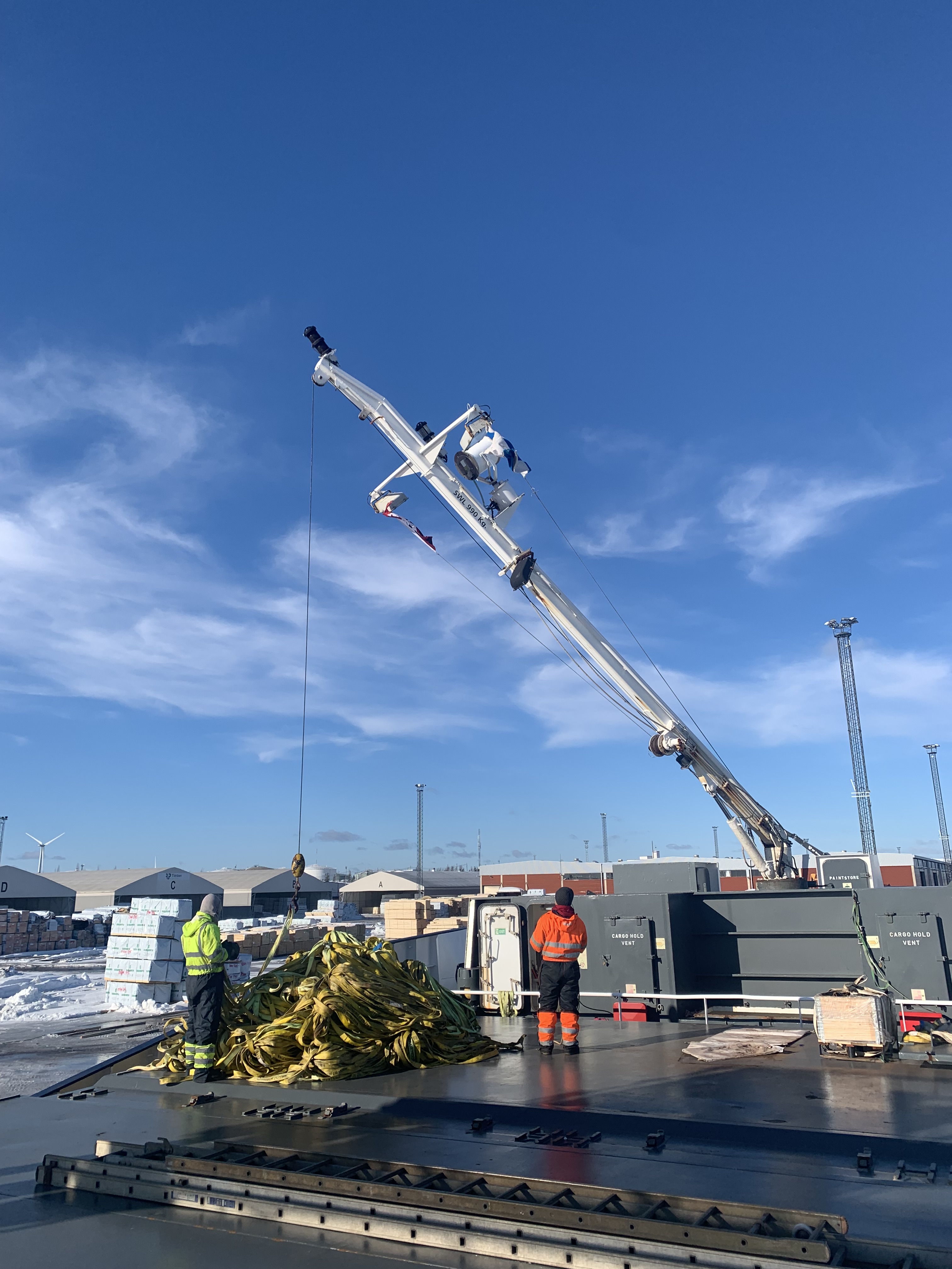 Getting ready for the timber cargo by taking out all the slings from the lashing store with help of the fore mast crane