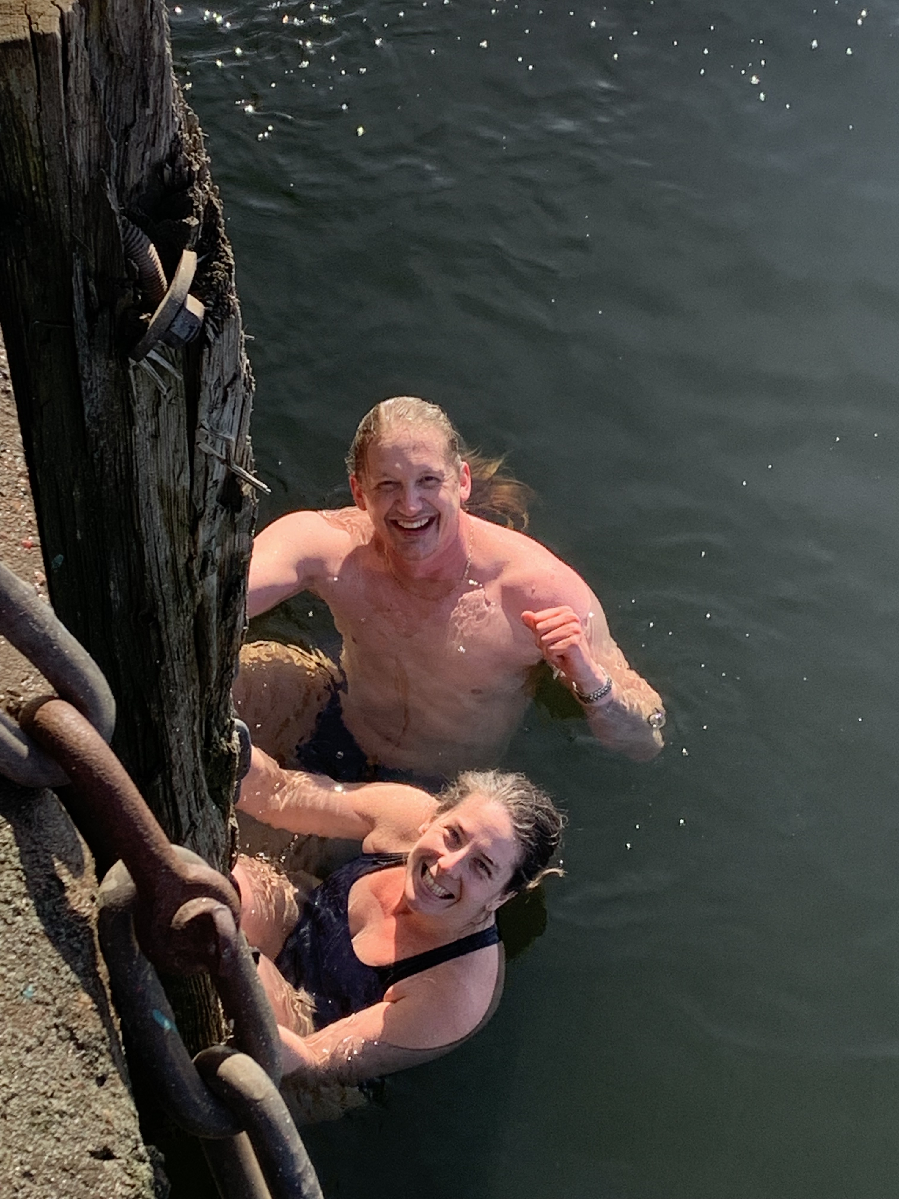 Captain H. and chief officer Sophie swimming in ice cold water