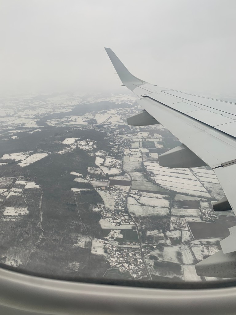 View from my window in the plane, on a snowy France